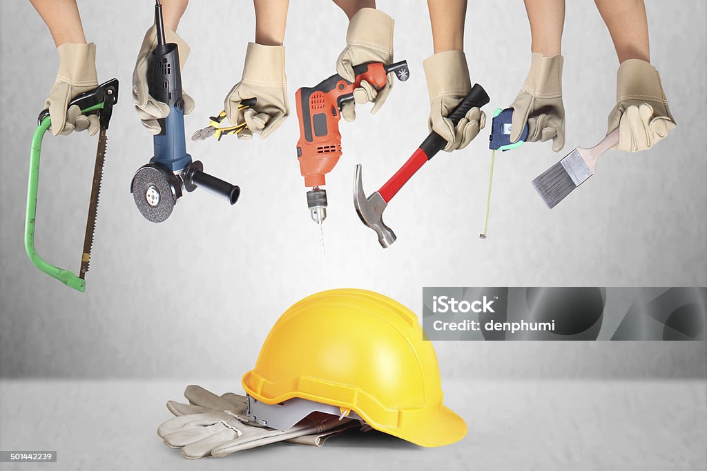 Selection of tools in the shape of a house Selection of tools in the shape of a house, home improvement concept Adjustable Stock Photo