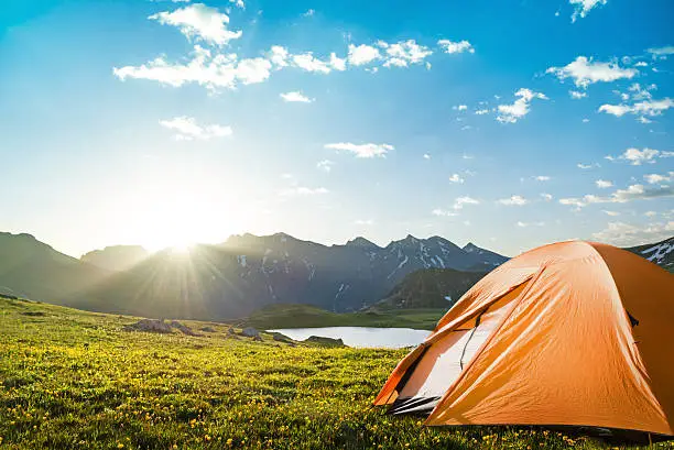 tourist tent camping in mountains