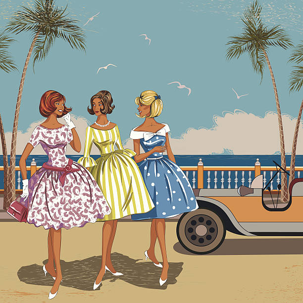 Three elegant women walking near the beach