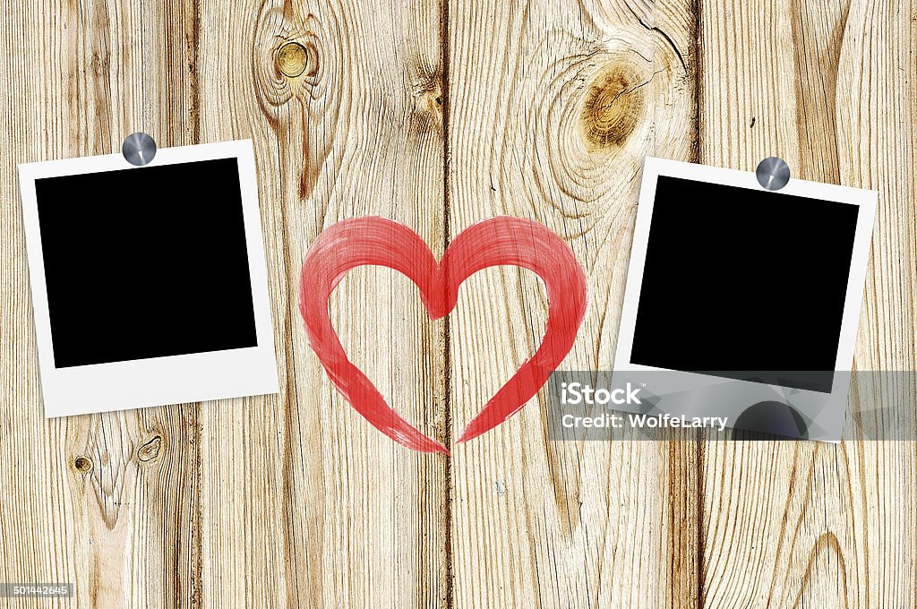 Blank old photos on clips and red heart on wooden Blank old photos on clips and red heart on color wooden background Brown Stock Photo