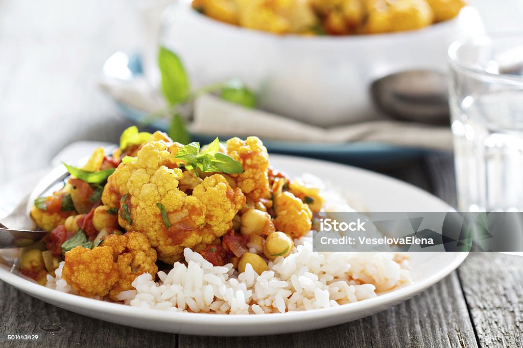 Vegan curry with chickpeas and vegetables Vegan curry with chickpeas, tomatoes and cauliflower Asian Culture Stock Photo