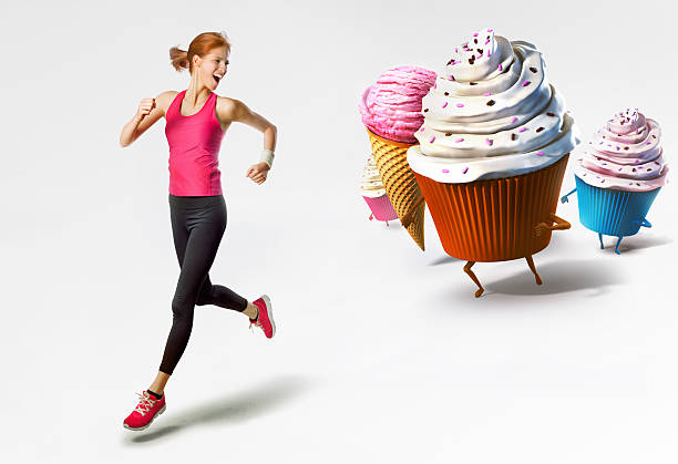 mujer corriendo desde dulces aislado - quick cookies fotografías e imágenes de stock