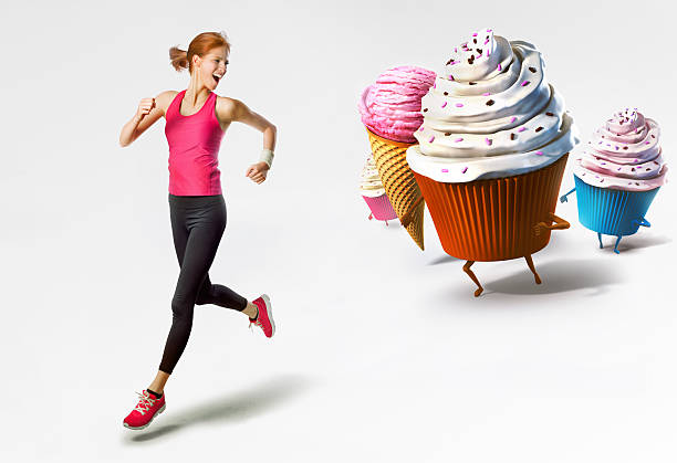 istock Woman running away from sweets isolated 501444773