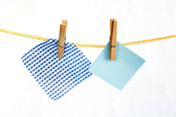 istock Note colored paper and and piece of checkered fabric 501444849