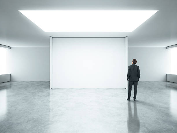 istock Young businessman standing in bright office 501446927