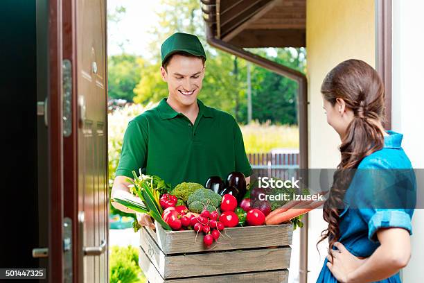 Delivery Man With Organic Food Stock Photo - Download Image Now - Delivering, Fruit, Supermarket