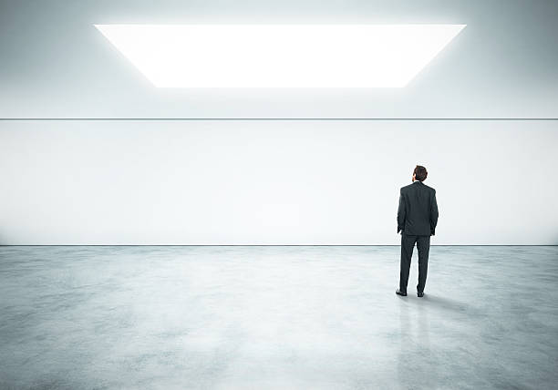 istock Young businessman standing in bright office 501447753