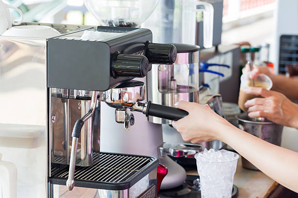 istock Hand make a latte cup of coffee machine. 501454298