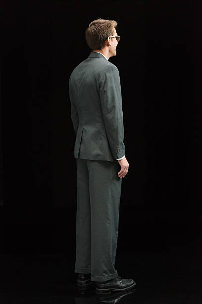 istock Rear view of businessman looking away 501454344