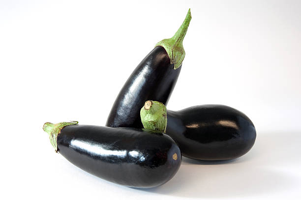 3 eggplants on a white background stock photo