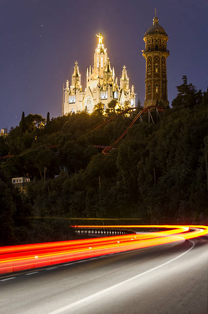 Collserola road up to the Tibidabo amusement park in Barcelona. In the background you can see the Expiatory Temple of the Sacred Heart that is next to the Amusement Park.