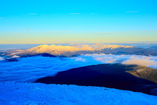 istock Sunrise in snowy mountains 501455456