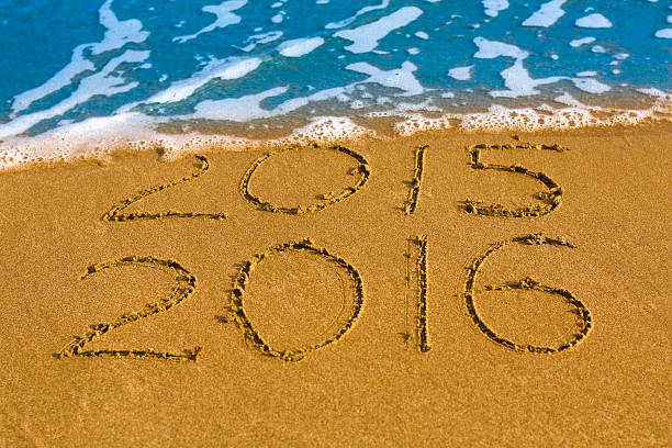 istock Happy New Year 2016 replace 2015 concept on sea beach 501455668