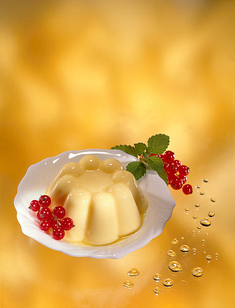 Vanilla pudding dessert on a yellow background stock photo