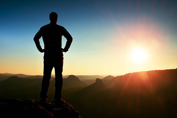 istock Man has hands on  hips. Sportsman in nature at daybreak. 501457008