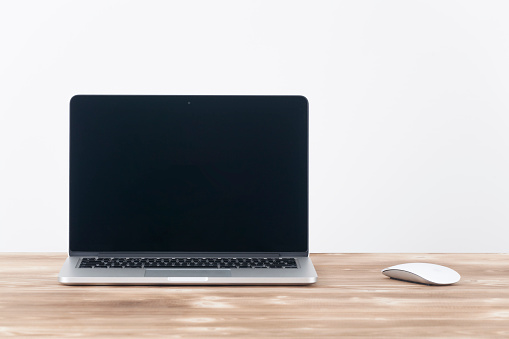 Çanakkale, Turkey - December 8, 2015: 13-inch Apple MacBook Pro.with Apple magic mouse 2 on table.