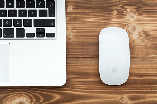 Çanakkale, Turkey - December 8, 2015: 13-inch Apple MacBook Pro.with Apple magic mouse 2 on table.