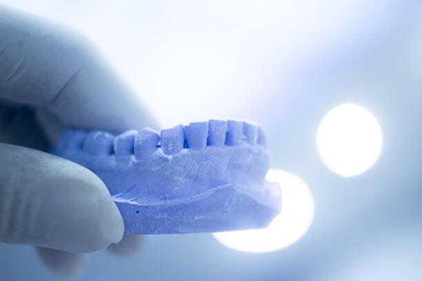 istock Dental mold dentists clay teeth ceramic plate cast 501459214