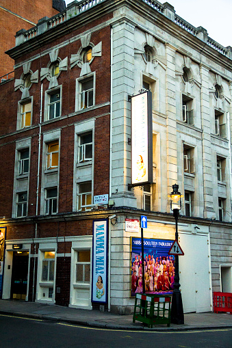 London, UK - June 4, 2015:  Teatre building on Tavistock street  with MAMMA MIA displays