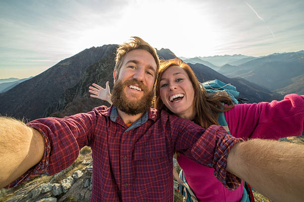 istock Two young adults hiking, take selfie portrait 501464748
