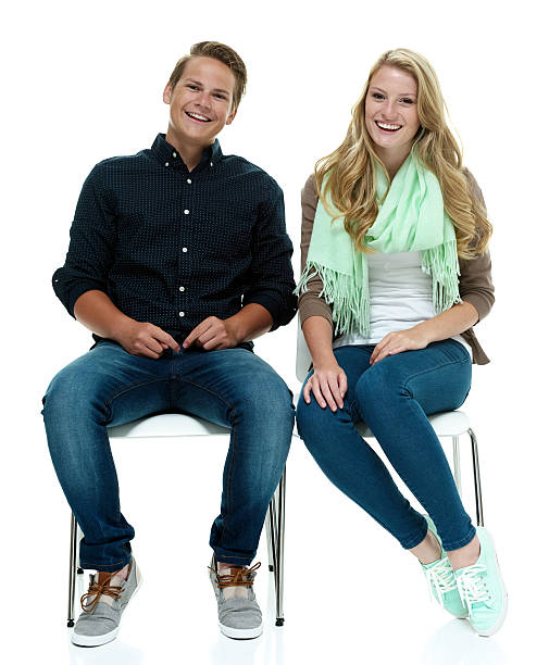 istock Smiling couple sitting on chair 501464994