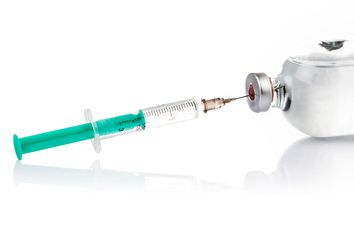 Syringe, needle, glass bottle
