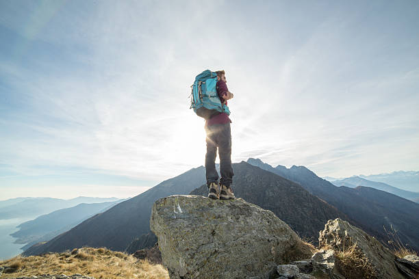 istock Young hiker man standing on a mountain top 501479604