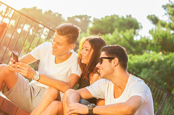 istock Friends amazed watching the smart phone outdoor. 501480152