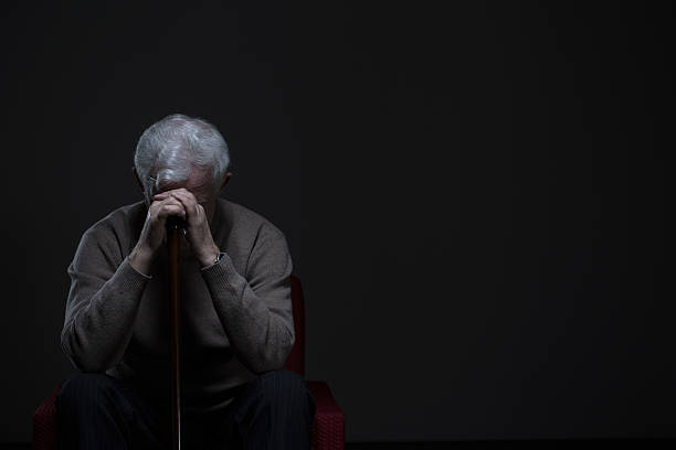 Elder man with depression Depressed old man hiding his face behind hands old man depressed stock pictures, royalty-free photos & images