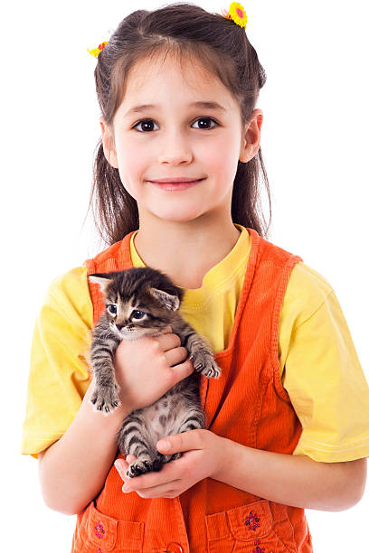Little girl with kitty in hands