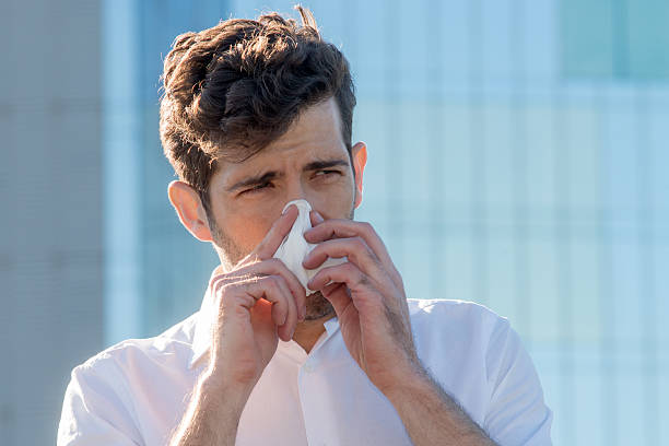 istock Man with handkerchief in the nose 501482572