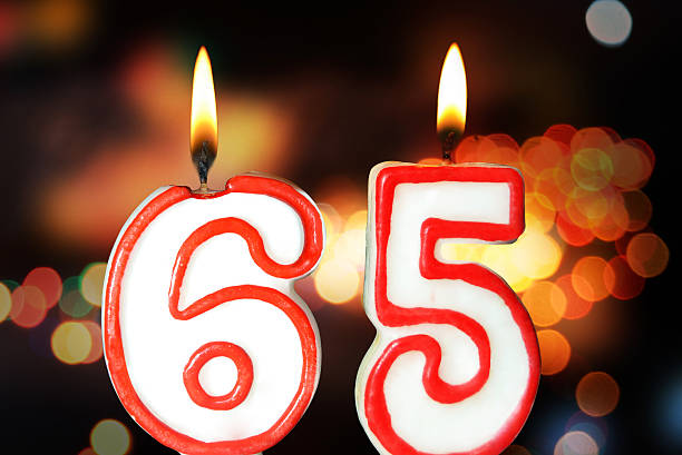 65th birthday Birthday candles celebrating 65th birthday 65 69 years stock pictures, royalty-free photos & images