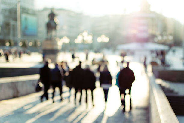 istock City commuters. High key blurred image of people walking 501484238