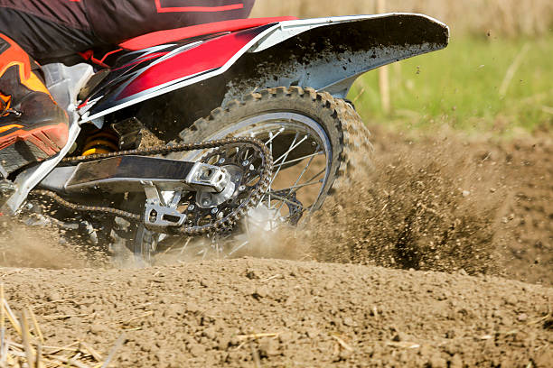 istock Motocross racer accelerating speed in track 501485798