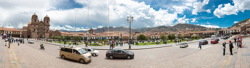 Cusco, Peru - January 14, 2015: Cusco Panorama of main Square (Plaza de Armas) with the Inca Statue in front of the Iglesia de la Compania with tourists in Cusco, Peru 2015