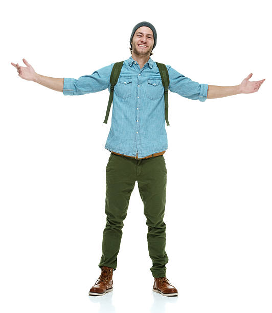 Smiling hipster standing with arms outstretched Smiling hipster standing with arms outstretchedhttp://www.twodozendesign.info/i/1.png arms outstretched photos stock pictures, royalty-free photos & images
