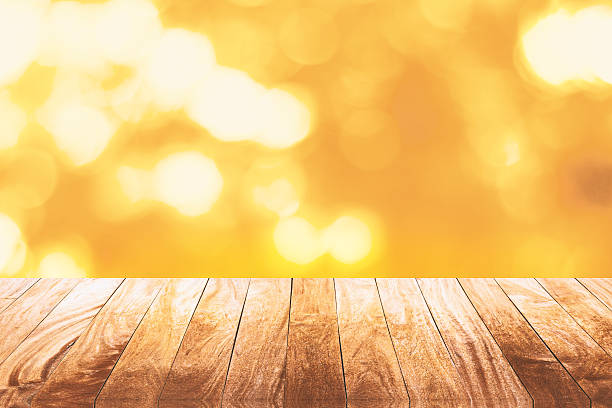 istock Wood floor on shiny bokeh gold 501491684