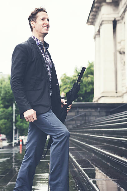 istock Young business man climbing steps on his way to work 501492028