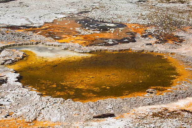istock Orange and brown, circular hot spring with limestone rim, Yellow 501492072