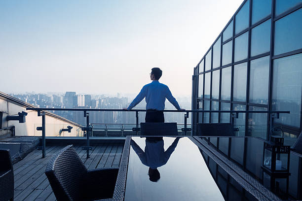 istock Businessman looking at cityscape 501502912