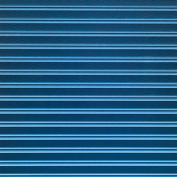 istock Dark metal roller door shutter background and texture 501504840