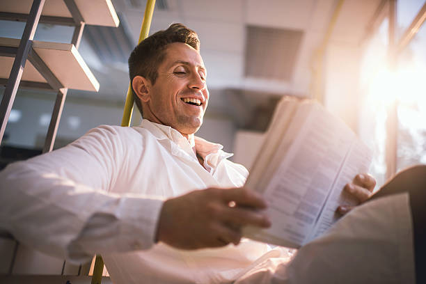 istock Below view of cheerful doctor reading medical data. 501508266