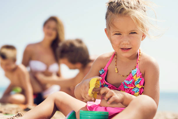 istock Cute girl playing on the beach during summer day. 501509724
