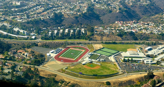 An aerial view of the Clairemont neighborhood in Bay Park, San Diego, southern California, United States of America. A view of the high school football court and softball field.