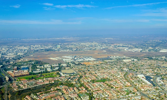 Aerial view of Mission Hills neighborhood and San Diego International Airport (Lindbergh Field), in Southern California, United States of America. An upscale affluent area in the city.