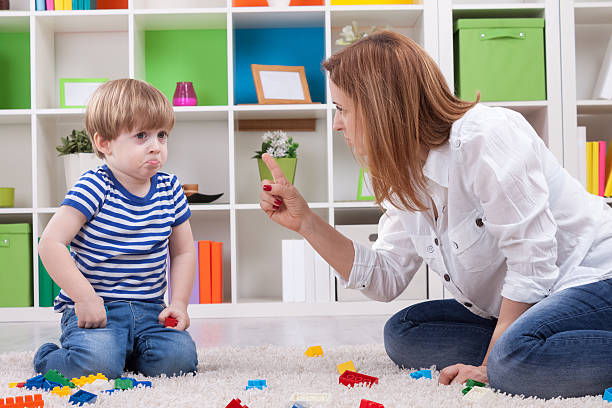 Angry mother scolding a disobedient child Angry mother scolding a disobedient child scolding stock pictures, royalty-free photos & images