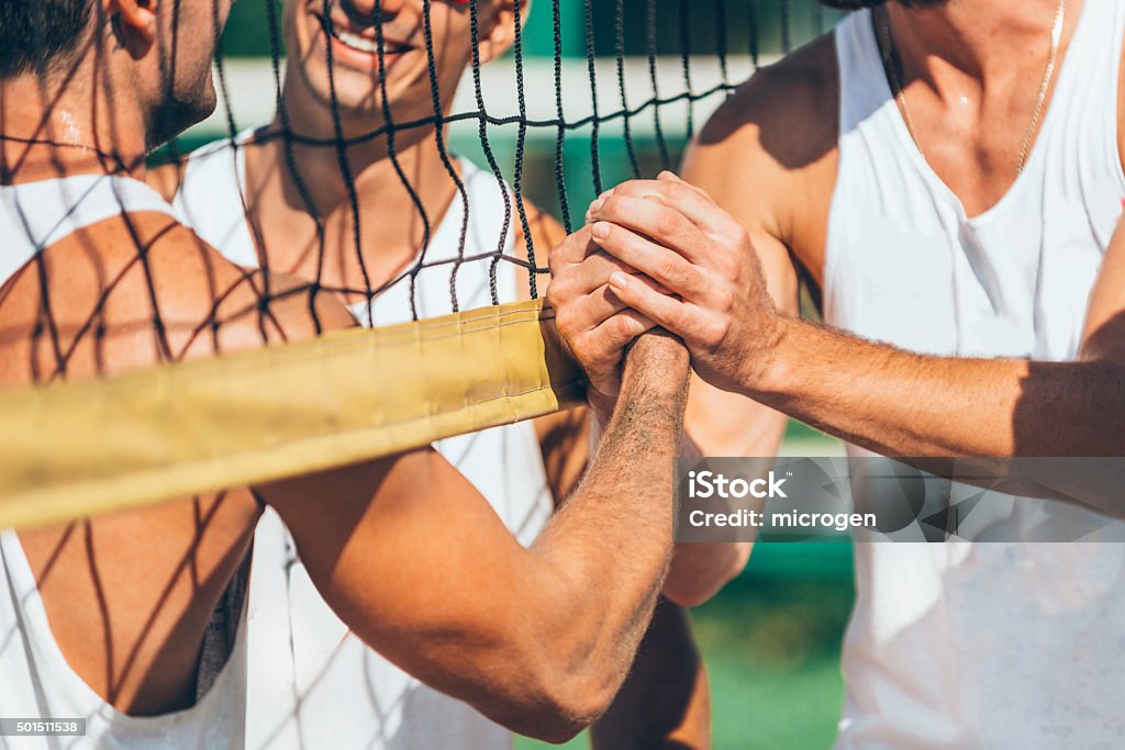 Beach volleyball teams congratulating after the match Sports Team Stock Photo