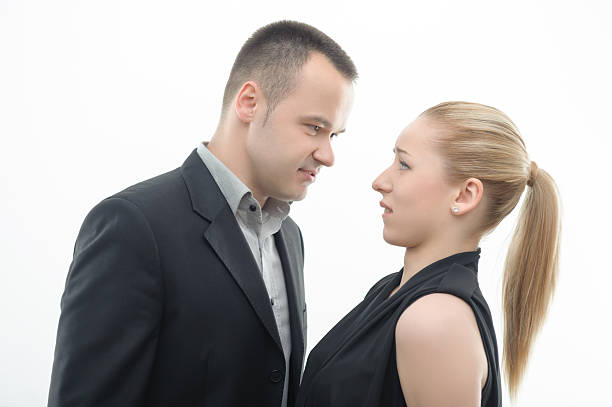 istock Colleagues shouting against each other on white background 501512339