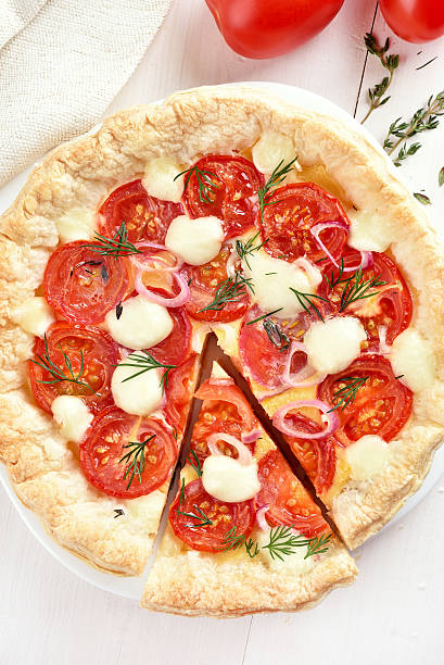 istock Sliced tomatoes pie with cheese and dill 501512412