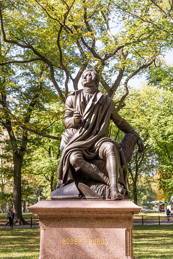 New York, USA - October 21, 2015: Statue of Poet/Lyricist Robert Burns, Central Park, New York City. Central park is the largest park in New York.